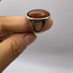 Vintage mid-century silver ring featuring a smooth oval stone